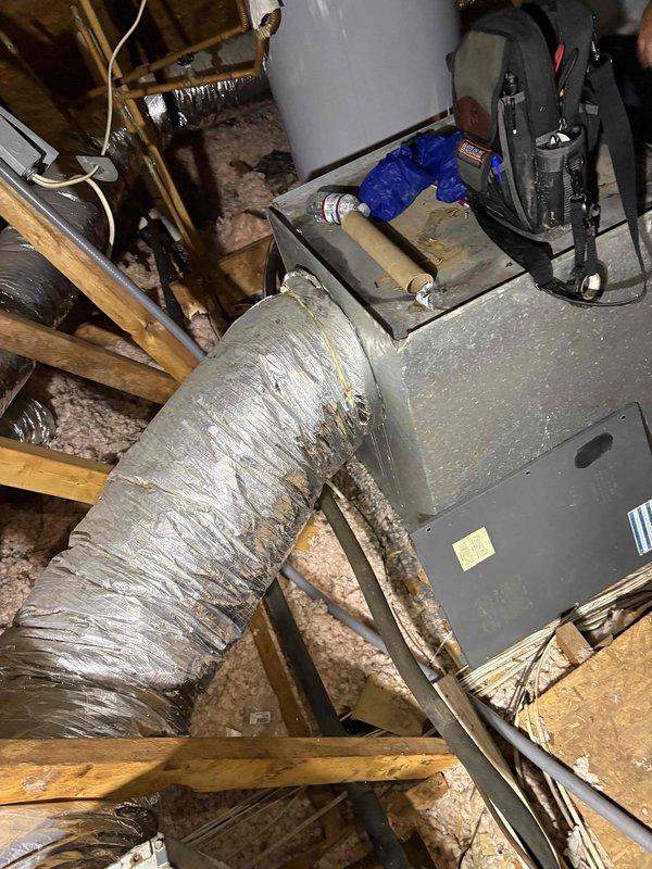 Completed comprehensive system cleaning and inspection on attic-mounted air handler unit. Upon arrival, customer reported inadequate cooling performance from the system. Performed thorough inspection of HVAC equipment, including air handler cabinet, ductwork connections, and associated components. Examined flexible ductwork runs for proper installation, potential air leakage, and compression issues that could restrict airflow. Noted ductwork configuration between joists and verified insulation wrapping integrity. Cleaned air handler components and assessed overall system operation. Provided information regarding available military discount program per customer inquiry.