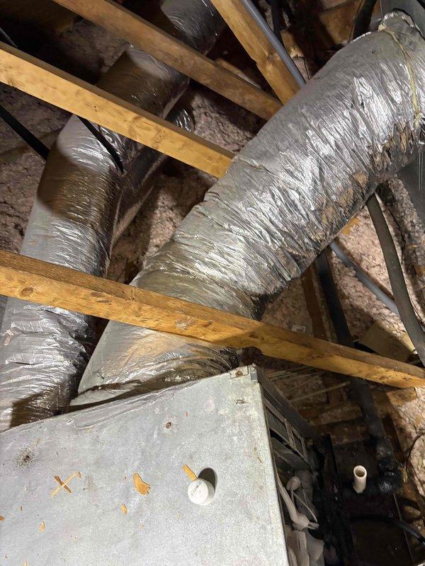 Completed comprehensive system cleaning and inspection on attic-mounted air handler unit. Upon arrival, customer reported inadequate cooling performance from the system. Performed thorough inspection of HVAC equipment, including air handler cabinet, ductwork connections, and associated components. Examined flexible ductwork runs for proper installation, potential air leakage, and compression issues that could restrict airflow. Noted ductwork configuration between joists and verified insulation wrapping integrity. Cleaned air handler components and assessed overall system operation. Provided information regarding available military discount program per customer inquiry.