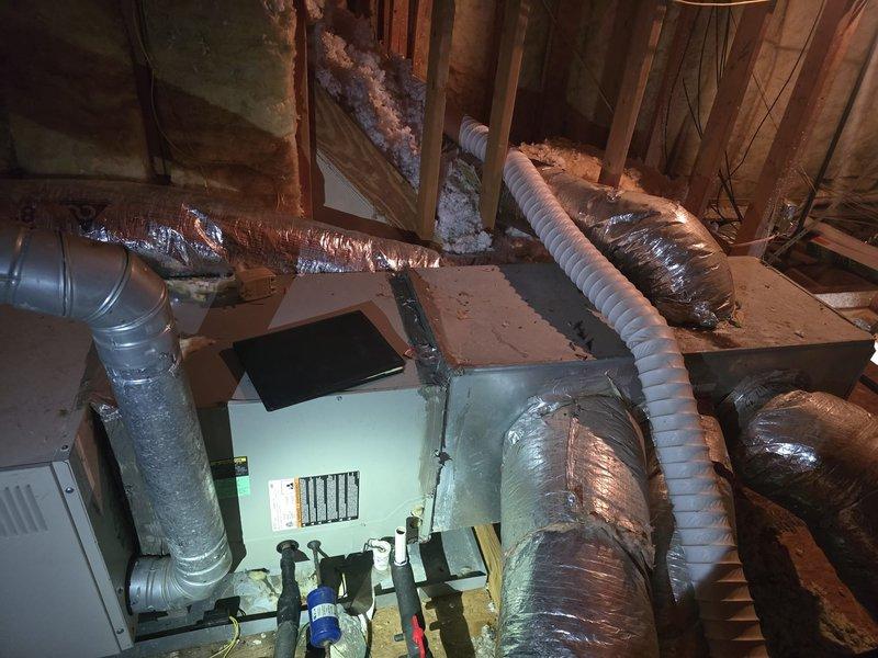 Completed installation of new HVAC system in residential attic space. Installation included routing and securing multiple flexible duct runs with proper insulation wrapping, connecting supply and return air distribution throughout the crawl space, and integrating all ductwork with the new heating and cooling equipment. All components were properly installed per manufacturer specifications and building codes, with ductwork strategically positioned between structural framing members to ensure optimal airflow and system efficiency.