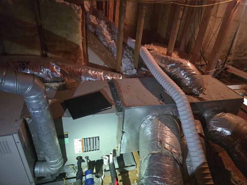 Completed installation of new HVAC system in residential attic space. Installation included routing and securing multiple flexible duct runs with proper insulation wrapping, connecting supply and return air distribution throughout the crawl space, and integrating all ductwork with the new heating and cooling equipment. All components were properly installed per manufacturer specifications and building codes, with ductwork strategically positioned between structural framing members to ensure optimal airflow and system efficiency.