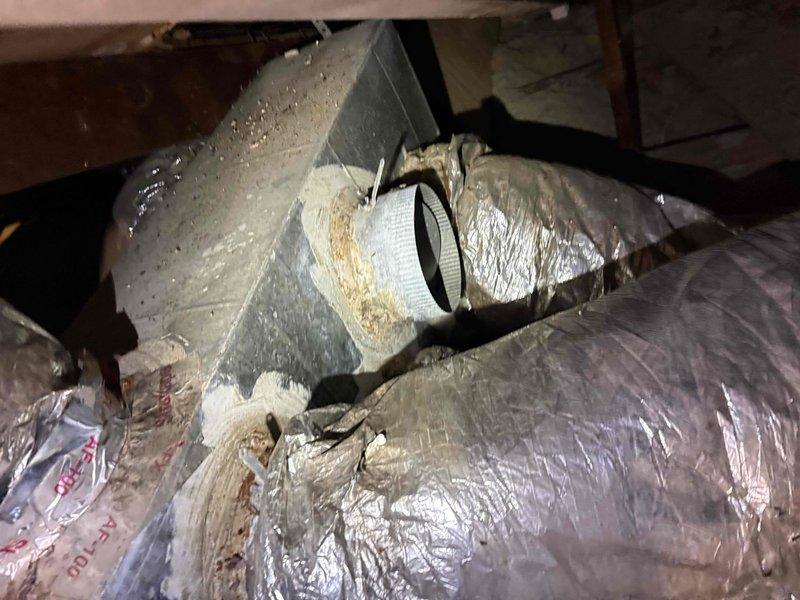 Responded to no cooling complaint on residential air conditioning system. Upon arrival, accessed attic-mounted air handler and outdoor condensing unit. Connected refrigerant manifold gauges to service ports and recorded system pressures and temperatures. Previous service history indicated recent compressor replacement with capacitor and hard start kit installation, along with UV dye injection for leak detection. Performed visual inspection of refrigeration lines, connections, and components in attic space. Evaluated system operating parameters using digital manifold gauge set to assess refrigerant charge and system performance. Documented findings with photographic evidence of equipment condition and diagnostic readings for further analysis and recommended follow-up leak search to verify system integrity.