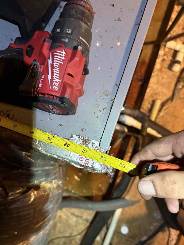 Responded to service call for recurring drain pan clogs on a 4-5 year old HVAC system. Performed diagnostic inspection of air handler unit located in attic space. Accessed equipment to assess condensate drainage system and identify cause of repeated blockages. Measured and documented system components and clearances. Inspected air handler, condensate pump assembly, and associated ductwork for proper operation and potential drainage issues. Evaluated installation configuration and equipment condition to determine appropriate corrective action for preventing future drain pan overflow.