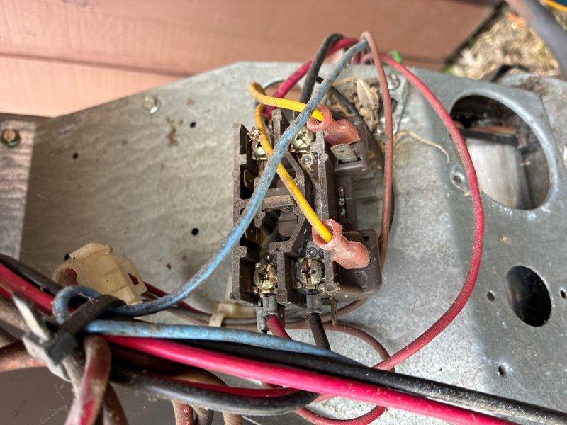 Completed scheduled late evening inspection on 3-ton R22 air conditioning system with focus on refrigerant level verification as requested. Performed electrical diagnostics using clamp meter, obtaining amperage readings on system components. Inspected contactor assembly and associated wiring connections, noting age-related wear on wire insulation and terminal connections. System evaluated and measurements documented for customer review.