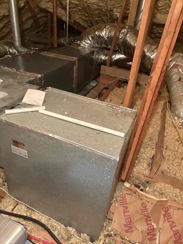 Performed callback service to address elevated indoor humidity levels reported at 73% during day and 63% at night. Conducted thorough inspection of attic-mounted HVAC system and ductwork. Sealed all joints and seams on both supply and return ductwork to eliminate hot attic air infiltration into the conditioned air system. Previous diagnosis identified air leakage as primary cause of humidity control issues. All duct connections, seams, and penetrations were properly sealed using appropriate materials to ensure airtight system operation and prevent unconditioned attic air from entering the airstream.