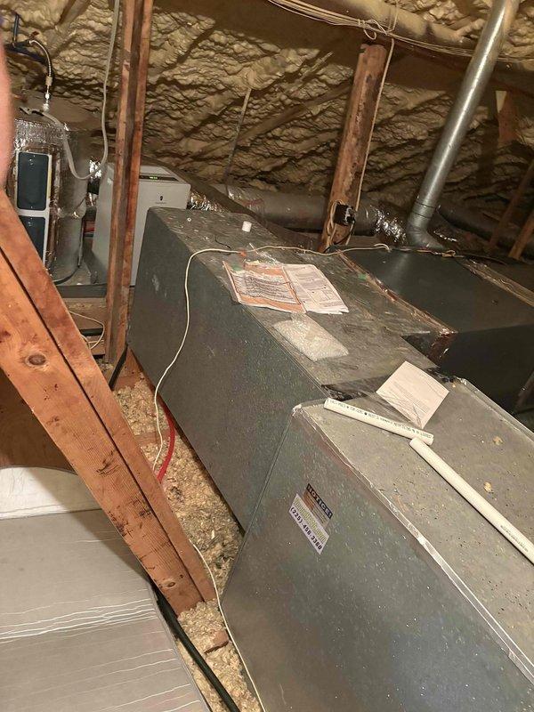 Performed callback service to address elevated indoor humidity levels reported at 73% during day and 63% at night. Conducted thorough inspection of attic-mounted HVAC system and ductwork. Sealed all joints and seams on both supply and return ductwork to eliminate hot attic air infiltration into the conditioned air system. Previous diagnosis identified air leakage as primary cause of humidity control issues. All duct connections, seams, and penetrations were properly sealed using appropriate materials to ensure airtight system operation and prevent unconditioned attic air from entering the airstream.