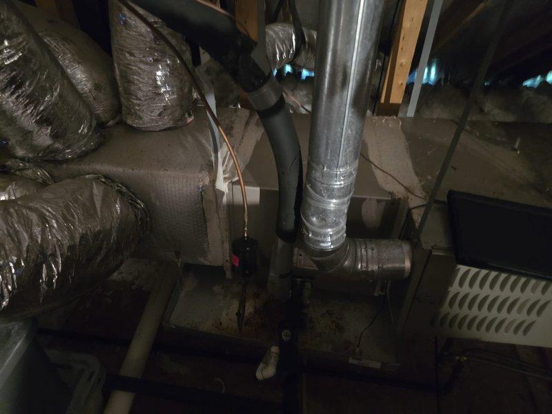 Completed installation of 3-ton condenser unit on exterior concrete pad with proper electrical connections and refrigerant lines. Integrated new outdoor unit with existing ductwork system in attic space, including flexible duct connections and metal transition pieces to ensure proper airflow distribution throughout the structure.
