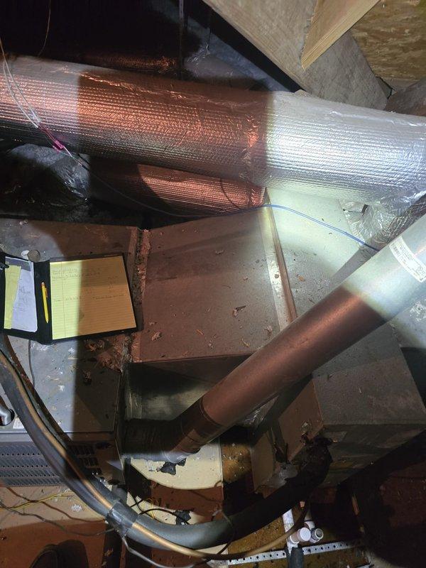Completed second opinion inspection of attic HVAC installation. Documented existing ductwork configuration including main trunk line with reflective foil insulation, gray metal plenum connections, and flexible copper-colored branch ducts. Photographed current system layout, insulation conditions, structural clearances, and equipment positioning for estimate preparation. Assessment of installation quality and identification of any necessary modifications or improvements pending final estimate completion.