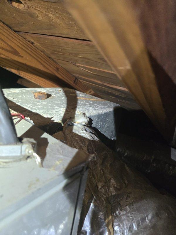 Performed second opinion evaluation for non-cooling HVAC system. Conducted thorough inspection of attic-mounted equipment and ductwork, documenting existing conditions including flexible duct routing, insulation placement, and structural configuration. Prepared comprehensive estimate for complete system replacement based on assessment findings.