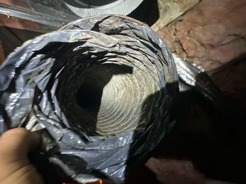 Responded to service call for upstairs unit that stopped cooling. Performed comprehensive leak search on upstairs HVAC system and completed annual cooling maintenance inspection. Installed return air filter and verified proper airflow through return air grille. Inspected flexible ductwork in attic space, examining interior insulation and verifying structural integrity of duct connections. Replaced air filter at return air vent and ensured proper system operation upon completion.