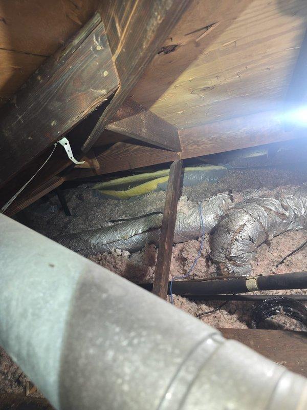 Completed comprehensive estimate for full HVAC system replacement of failed 4-ton unit. Existing system deemed non-operational and beyond economical repair. Documented current attic installation conditions including deteriorated flexible ductwork, compromised insulation coverage, and outdated equipment configuration to provide accurate replacement specifications and scope of work required.