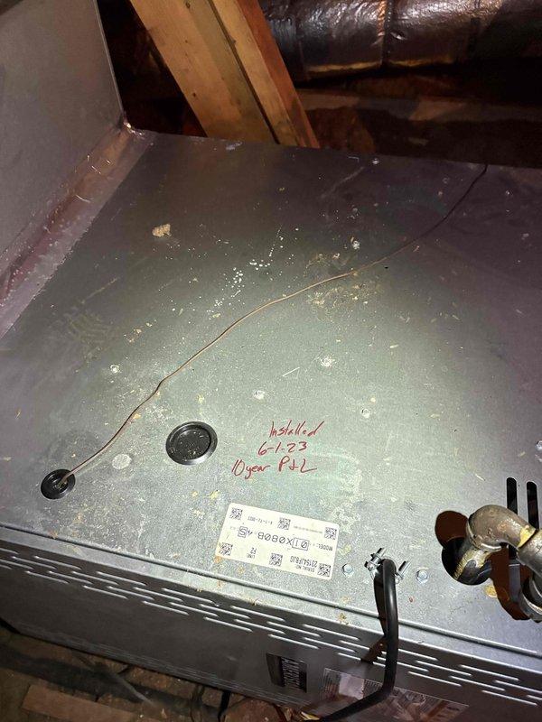 Responded to service call for intermittent thermostat display blanking causing AC system shutoff. Customer reported Honeywell thermostat would randomly lose display and shut down air conditioning operation, though no cooling performance issues were present when system was running. Performed diagnostic inspection of HVAC system including attic-mounted air handler unit installed June 2023, documented refrigerant line connections, condensate drainage system, and electrical wiring configuration. Assessed thermostat power supply and system operation to determine cause of intermittent display failure.