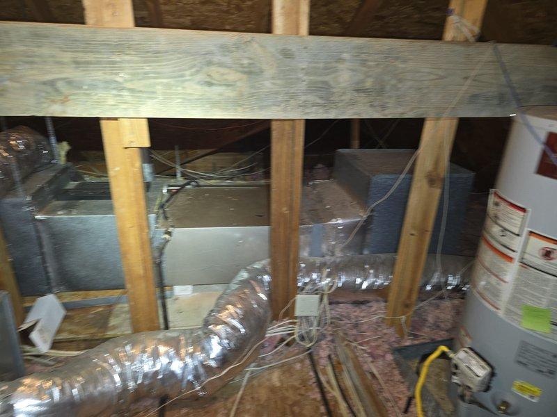 Conducted attic assessment for HVAC system evaluation. Inspected existing ductwork configuration, including central plenum distribution box and flexible insulated branch ducts running throughout the attic space. Documented current system layout, structural framing, and insulation conditions. Prepared estimate for window unit installation as discussed with customer.