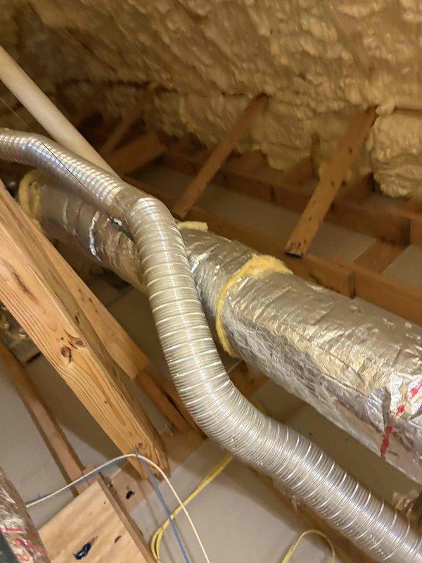 Completed comprehensive inspection of three HVAC systems: master bedroom 2-ton unit, living room 4-ton unit, and upstairs 2-ton unit. All systems were found to be operating within normal parameters with no mechanical deficiencies noted. Verified proper operation of compressors, air handlers, refrigerant pressures, and airflow on all three units.

Inspected upstairs bathroom exhaust vent ducting in response to minor mold concerns identified during home inspection. Confirmed vent ductwork is properly installed and terminates to building exterior as required by code. Flexible aluminum ductwork observed in attic space shows proper support, secure connections, and adequate insulation. No disconnections, improper terminations, or code violations were identified. Mold occurrence appears related to inadequate ventilation fan usage during bathroom use rather than any mechanical deficiency.

Replaced three 12x12x1 air filters on the upstairs 2-ton system as requested. Confirmed the two other sys