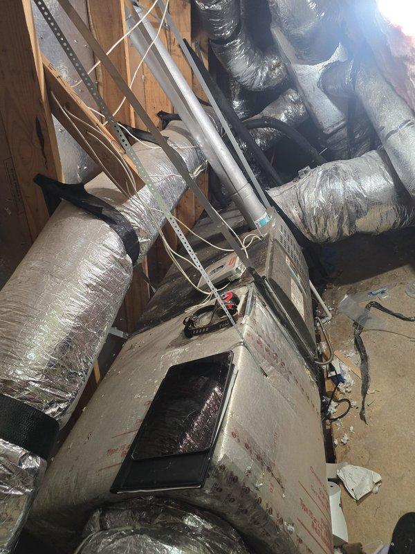 Completed comprehensive estimate for ductwork replacement in residential attic space. Documented existing HVAC system showing deteriorated air handler unit with significant rust and corrosion, along with heavily soiled flexible ductwork exhibiting accumulated dust, dirt, and compromised insulation integrity throughout the installation.