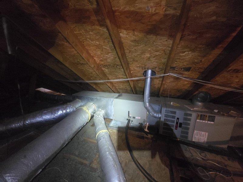 Provided estimate for complete HVAC system replacement on 24-year-old residential unit with confirmed refrigerant leak in existing system. Evaluated attic-mounted air handler with associated ductwork and exterior condensing unit, documented current equipment condition and installation requirements for replacement system.