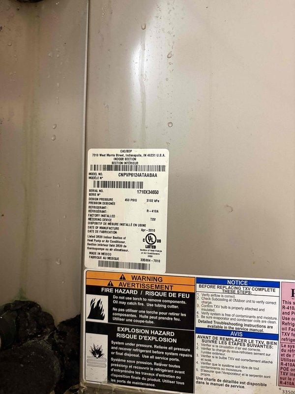 Completed comprehensive maintenance inspection and cleaning on 17-year-old HVAC system (Model: CNPVP6124A7A8BA, manufactured March 2018, R-410A refrigerant). Performed standard preventive maintenance procedures on outdoor condenser unit to maximize system longevity for new homeowner. Documented equipment condition with photographs showing outdoor installation, refrigerant line set, and manufacturer specification labels, noting visible weathering and surface staining consistent with system age.