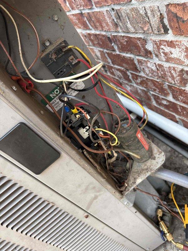 Responded to service call for R22 system experiencing freeze-up issues. Performed diagnostic evaluation to identify root cause of recurring refrigerant loss and system icing. Inspected expansion valve operation, verified airflow across evaporator coil, and conducted leak detection procedures on refrigerant lines and connections. Documented equipment condition with photos showing outdoor unit electrical components and control board assembly. System requires further evaluation for potential expansion valve malfunction or airflow restriction contributing to low-side freeze conditions, as unit has history of refrigerant additions and is aging R22 equipment approaching end of service life.