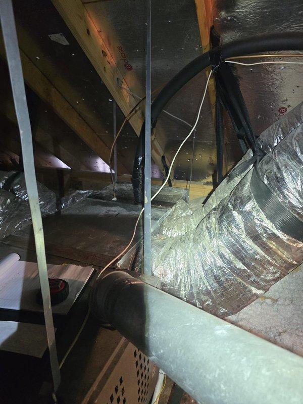 # Install - Large Completion Summary

Successfully completed installation of new evaporator coil, plenum, and transition components in residential attic space. Unit specifications verified on manufacturer label showing SD42 model rated for 208-230V operation with 17.5/13 FLA fan motor. All HVAC components properly positioned and secured within attic joists, with flexible ductwork routed and connected to new plenum assembly. Installation meets ETL certification standards and manufacturer requirements for proper airflow and system operation.