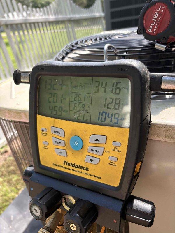 Responded to complaint of upstairs unit not maintaining temperature during daytime hours. Upon arrival, performed diagnostic testing of the HVAC system using calibrated digital manifold gauges and refrigerant measurement equipment. Measured system pressures, temperatures, and superheat/subcooling values to assess refrigerant charge and overall system performance. Documentation captured showing readings of operating pressures and temperatures across the system. Equipment tested included outdoor condensing unit with evaluation of refrigerant levels and system operating parameters to identify cause of inadequate cooling capacity during peak load conditions.