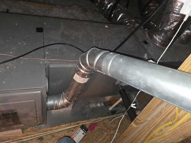 Completed coil replacement and annual cooling maintenance on residential HVAC system located in attic space. Removed and replaced evaporator coil on gray metal air handler unit positioned on support blocks. Verified proper connection of gas line to unit and inspected all ductwork connections including metallic supply duct with copper elbow joint. Checked electrical connections and wiring throughout system. Performed comprehensive cooling system maintenance including inspection of all mechanical components, ductwork integrity, and insulation wrapping. Confirmed proper airflow through supply ducts and verified system operation. All work completed same day per purchase order specifications with materials picked up from supply house. System tested and operating within manufacturer specifications upon completion.