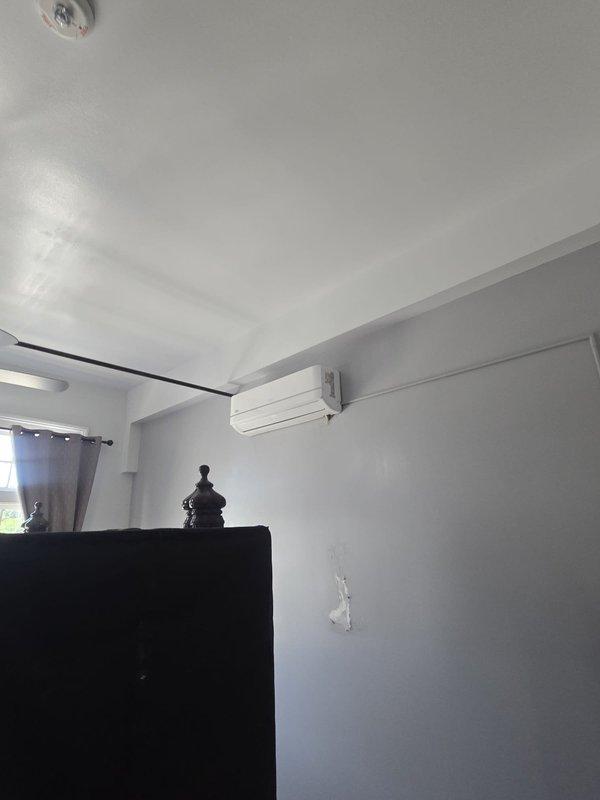 Provided labor-only installation estimate for customer-supplied ductless mini-split systems. Site assessment completed for two interior locations: main living area with existing wall-mounted unit and upper-level attic space with sloped ceiling configuration requiring careful placement considerations for optimal airflow and drainage routing.