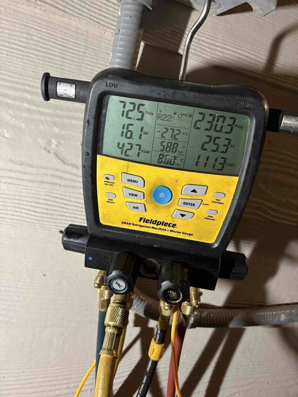 Responded to after-hours diagnostic call for frozen refrigerant line. Upon arrival, customer reported line had been frozen but was nearly thawed. Inspected HVAC system in attic space and observed significant condensation present on air handler unit and flexible ductwork surfaces. Connected Fieldpiece SMAN digital manifold gauges to system and recorded temperature and pressure readings across multiple zones to assess system performance and identify cause of freeze condition. Instructed customer to operate system fan to complete defrosting process and allow proper airflow circulation. Documented system conditions with photos showing gauge readings and condensation on equipment for further evaluation of potential airflow restriction, refrigerant charge issues, or thermostat cycling problems that may have contributed to coil freezing.