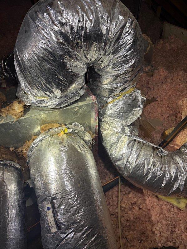 Completed small HVAC installation in vacant residential attic space, including flexible ductwork routing and connection to existing system. Installed and secured metallic flex ducts with proper support strapping, sealed all connections with mastic and foil tape, and verified proper placement over existing fiberglass insulation to maintain thermal efficiency.