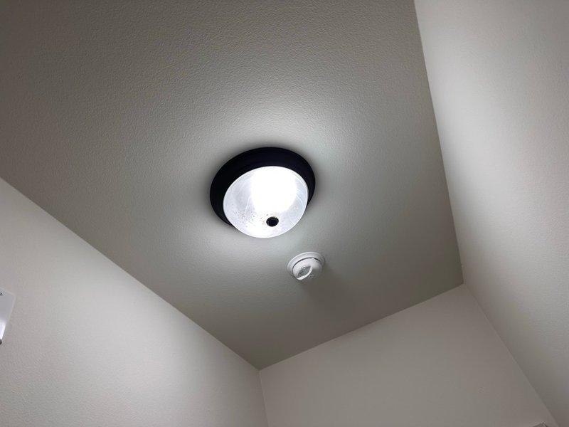 Relocated non-functional smoke detector 36 inches away from air return vent to ensure proper operation and code compliance. Replaced damaged detector frame that was compromised during previous installation, and installed new smoke detector unit in optimal ceiling location away from airflow interference.