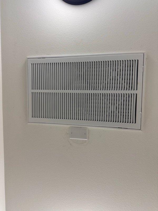 Relocated non-functional smoke detector 36 inches away from air return vent to ensure proper operation and code compliance. Replaced damaged detector frame that was compromised during previous installation, and installed new smoke detector unit in optimal ceiling location away from airflow interference.