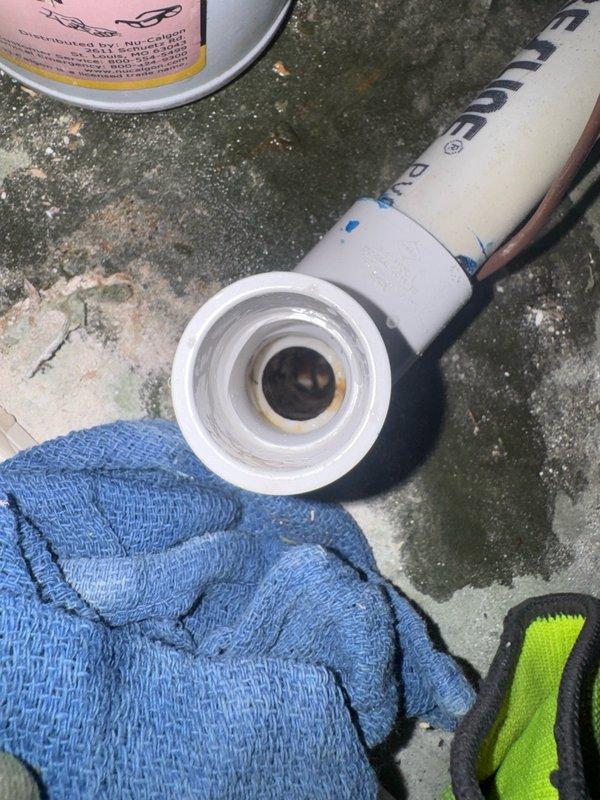 Responded to callback for downstairs AC unit displaying system offline status due to drainage issue. Upon arrival, accessed unit and identified clogged condensate drain line preventing proper system operation. Cleared blockage from PVC drain line and verified proper drainage flow. Inspected drain pan for standing water and confirmed pan was draining correctly after clearing obstruction. Checked refrigerant lines and connections for any secondary issues. Cycled system on to verify unit came back online and resumed normal cooling operation. Left work area clean and advised proper system function restored.