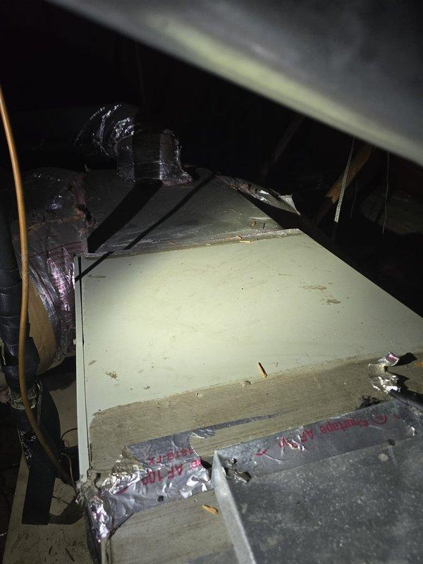 Completed installation of new evaporator coil in attic-mounted air handler unit. Unit was properly secured to wooden framing with all refrigerant connections completed, flexible ductwork attached to plenum, and electrical conduit routed to equipment. System was positioned vertically on structural supports with appropriate clearances maintained for service access and airflow.
