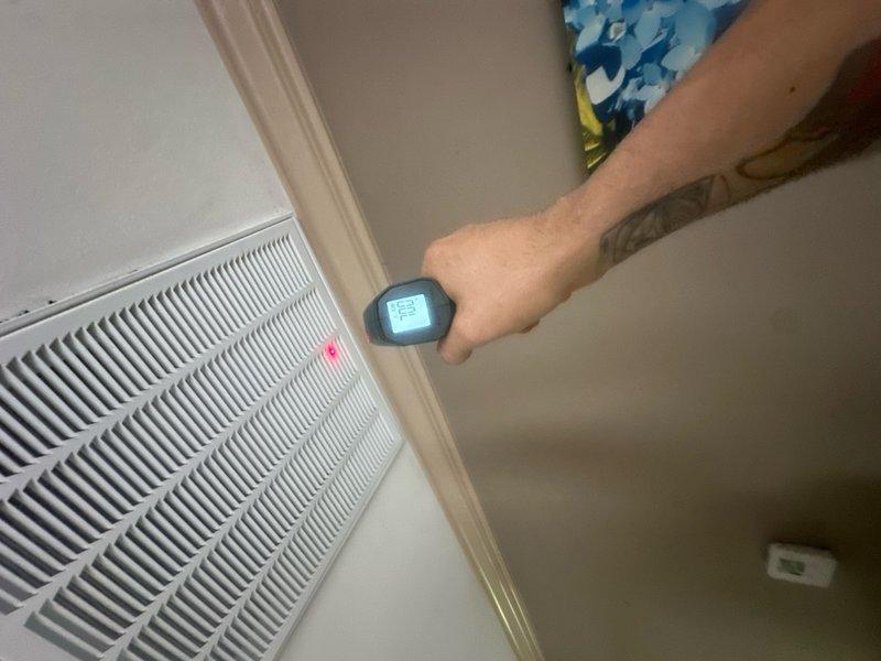 Responded to callback for upstairs HVAC unit failing to reach setpoint, with thermostat set at 75°F but space temperature holding at 80°F. Performed diagnostic assessment including airflow measurements at return air vent and inspected ductwork system in attic space. Technician dispatched same day to investigate temperature differential and system performance issues.