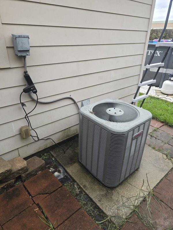 Diagnosed failed compressor and capacitor on 12-year-old outdoor condensing unit serving downstairs zone of dual-system residence. Air handler for affected system was previously replaced in 2021. Upstairs system operating normally.