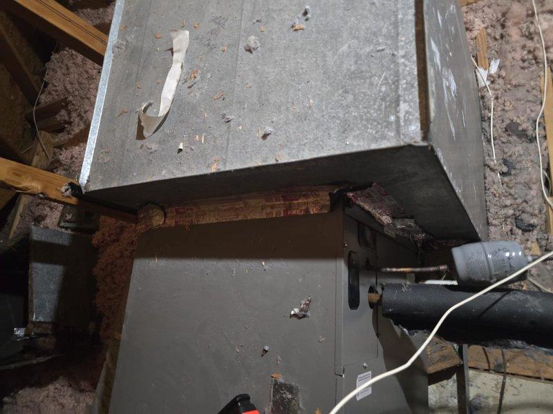 Conducted comprehensive HVAC system evaluation of residential installation including attic-mounted air handler with metal ductwork and exterior condensing unit. Documented existing equipment condition, insulation placement, and outdoor unit positioning on concrete pad adjacent to structure. Photographed system components to provide estimate for requested work per lead specifications.