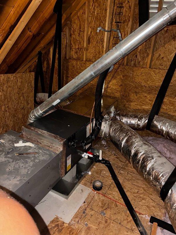 # Install - Medium Completion

Completed plenum change out and installed new 2-ton Amana evaporator coil in attic space. Removed existing deteriorated plenum and associated damaged flexible ductwork showing extensive wear with torn outer foil covering and exposed insulation material. Installed new plenum assembly and mounted 2-ton Amana coil on air handler platform. Connected metallic supply ductwork to new plenum with proper sealing at all joints. Secured all ductwork connections with appropriate straps and supports. Verified proper coil positioning and clearances for maintenance access. System ready for refrigerant line connection and startup procedures.