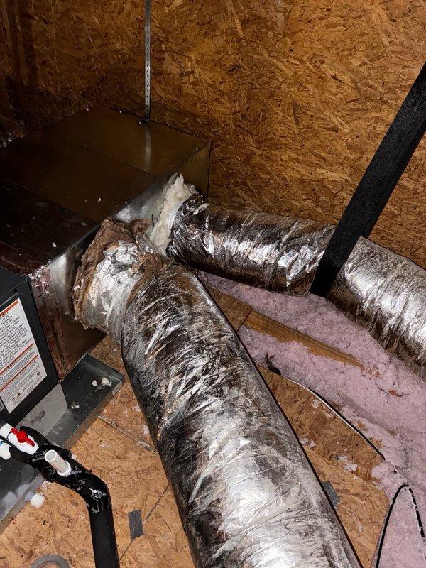# Install - Medium Completion

Completed plenum change out and installed new 2-ton Amana evaporator coil in attic space. Removed existing deteriorated plenum and associated damaged flexible ductwork showing extensive wear with torn outer foil covering and exposed insulation material. Installed new plenum assembly and mounted 2-ton Amana coil on air handler platform. Connected metallic supply ductwork to new plenum with proper sealing at all joints. Secured all ductwork connections with appropriate straps and supports. Verified proper coil positioning and clearances for maintenance access. System ready for refrigerant line connection and startup procedures.