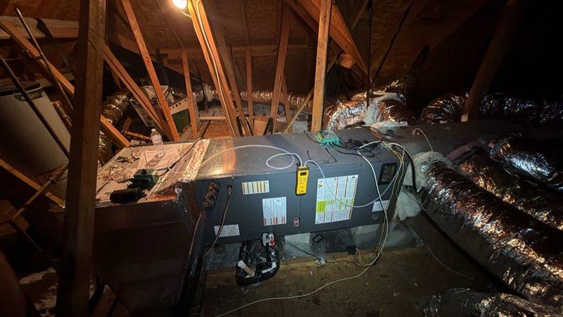 Completed warranty replacement of residential HVAC system, removing existing 4-ton unit and installing new 3-ton Amana system. Air handler was positioned in attic space with proper ductwork connections utilizing flexible metallic ducting. Outdoor condenser unit was installed on ground level against brick exterior wall. All electrical connections, refrigerant lines, and condensate drainage were properly configured. System was tested for proper operation and all warranty documentation was obtained prior to departure. Equipment had been pre-delivered to shop for staging prior to installation.