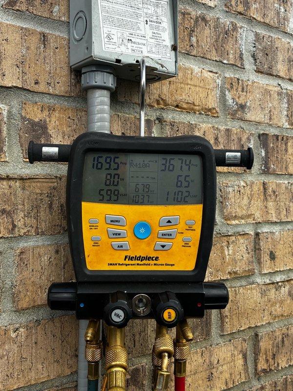 Responded to callback for system blowing warm air following coil replacement. Upon arrival, performed diagnostic testing of the HVAC system to identify cause of inadequate cooling. Utilized Supco capacitor tester to verify electrical component functionality, confirming capacitor readings within acceptable range as indicated by green LED display in "GOOD" zone. Connected Fieldpiece digital manifold gauge set to measure system pressures and temperatures. Recorded operating pressures and superheat/subcooling values to assess refrigerant charge and system performance. Analysis of gauge readings revealed improper refrigerant charge affecting cooling capacity. Adjusted refrigerant levels to manufacturer specifications and verified proper system operation. System now cooling effectively with pressures and temperatures within normal operating parameters.