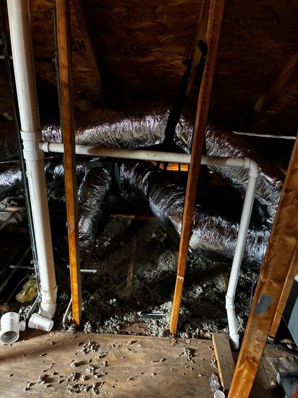 Completed full ductwork replacement in residential attic space, removing all existing 10" flex ducts and installing new 9x7x7 rectangular flex duct runs throughout the system. Replaced supply plenum with new unit and modified bedroom supply box to 12x6x8 configuration with dedicated 8" duct run to bedroom for improved airflow. Retained existing 6" and 8" round ducts where appropriate and installed two additional 7" collars on plenum to accommodate alternate duct configurations. All flex ductwork properly secured with straps to ceiling joists and routed to minimize compression and sagging for optimal HVAC system performance.
