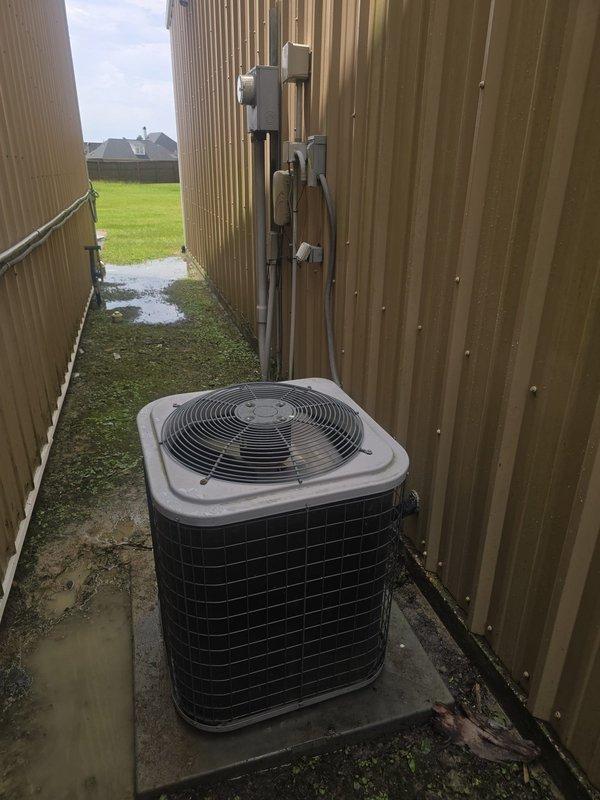 Conducted on-site consultation to assess residential HVAC system and discuss replacement options. Documented existing system configuration including attic-mounted air handler with flexible ductwork and fiberglass insulation, along with exterior condensing unit installed between property fences with electrical disconnect and refrigerant line set. Reviewed equipment condition and provided recommendations for system upgrades based on current installation parameters.
