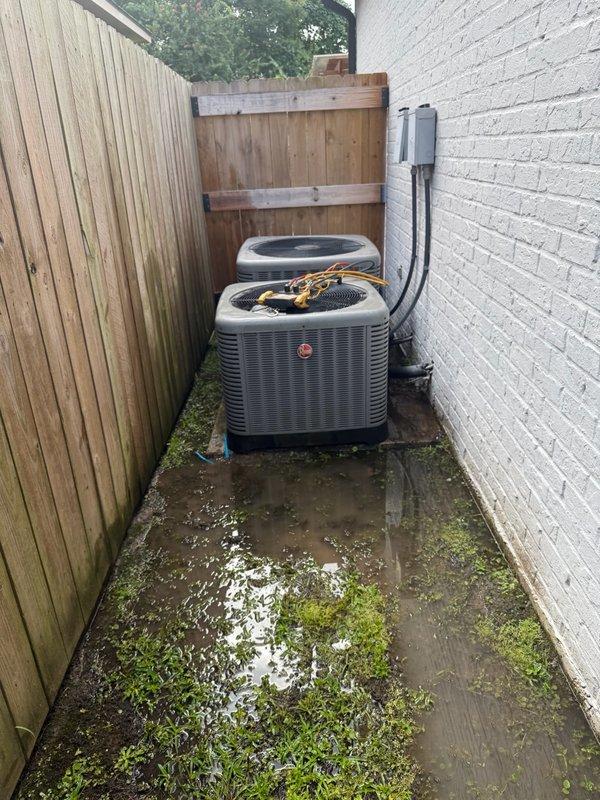 Completed medium-level installation service involving refrigerant addition and minor duct leak repairs on dual HVAC condenser units. Successfully addressed refrigerant deficiency by adding appropriate charge to system and performed necessary repairs to resolve minor ductwork leakage issues. Both Rheem condenser units are now operational and properly charged, with all refrigerant lines connected and secured between the two systems installed on exterior concrete pads.