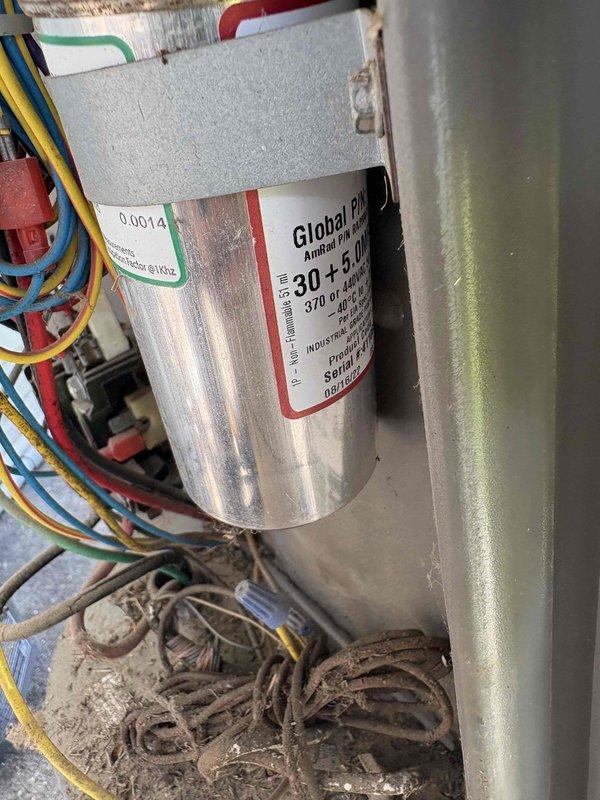 Performed comprehensive inspection of two commercial air conditioning units for prospective property buyer to assess current operational status and remaining equipment lifespan. Conducted thorough visual examination of all accessible components including electrical connections, capacitors, blower assemblies, and ductwork. Documented equipment condition through photographic evidence showing dual-rated capacitor (30+5 μF, 370/440 VAC), wiring configurations, and blower motor housings with ventilation components. Both units showed normal operational wear with minor dust accumulation on surfaces and mechanical components. Provided detailed assessment of system condition and estimated remaining service life to assist with property purchase decision.