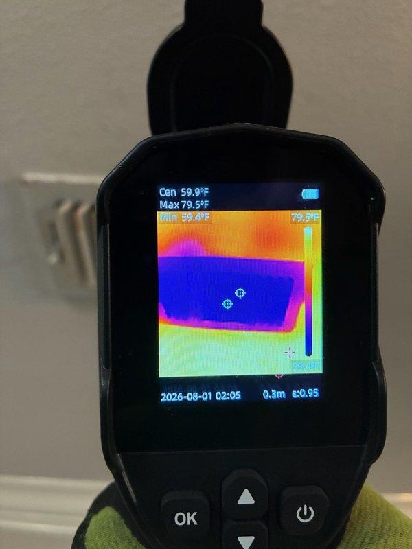 Responded to no-cooling call on residential HVAC system. Customer reported outdoor condenser fan not operating on one of two systems. Upon arrival, performed visual inspection of outdoor unit electrical components and identified failed dual-run capacitor. Conducted thermal imaging scan of affected area to verify temperature differentials and confirm lack of compressor operation due to capacitor failure. Documented existing wiring configuration showing connections between capacitor, contactor, and system components. Advised customer of findings and provided repair options to restore system functionality.