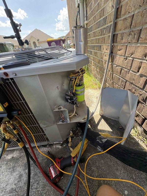 Responded to no-cooling call for downstairs system in dual-system residence. Upon arrival, confirmed condenser fan motor was inoperative while compressor attempted to run. Performed diagnostic testing using digital multimeter to verify electrical supply and motor functionality. Testing revealed condenser fan motor had failed and was not receiving proper voltage due to motor winding failure. Unit is original equipment, approximately 7 years old. Explained findings to customer and provided options for repair, including fan motor replacement to restore system operation.
