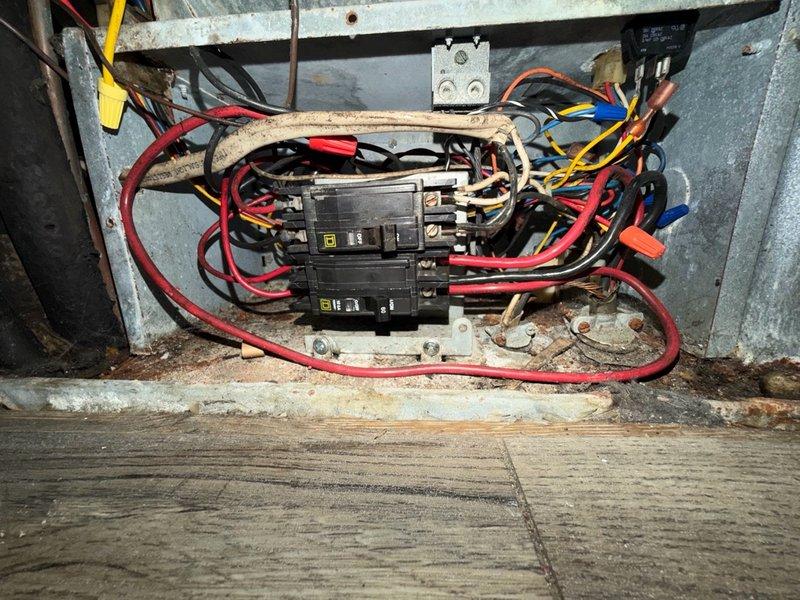 Completed installation of new relay on HVAC system located in outdoor/semi-exposed enclosure. Replaced failed relay component and secured all electrical connections including red, blue, orange, yellow, and black wiring with appropriate wire nuts. System tested and verified operational upon completion.