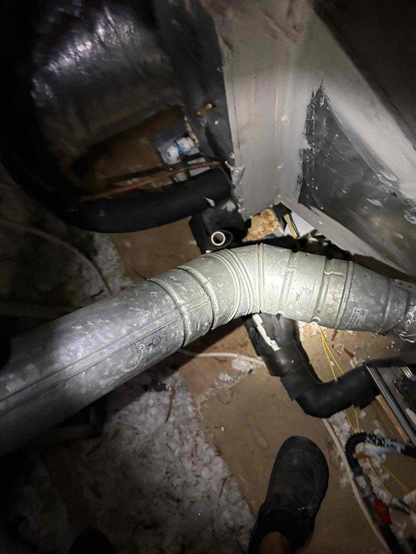 Responded to emergency service call regarding HVAC system fire incident. Customer reported system caught fire and fire department was dispatched to residence. Upon arrival, conducted thorough inspection of system installed in 2016 to identify burnt wiring or electrical failure points. Inspected control board and electrical components in mechanical room, examining for signs of thermal damage, arcing, or wire insulation failure. Documented condition of system components with photographs. Assessed ductwork and attic installation area for additional fire damage or compromised wiring. Investigation focused on locating source of electrical failure that caused fire event to ensure system safety before any restoration work could proceed.