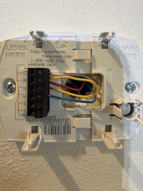 Completed installation of customer-supplied Honeywell dehumidifier system. Performed hardwire electrical connection at thermostat control, terminating multiple conductors to designated terminal block per manufacturer specifications. Verified proper voltage reading of 119.3V at equipment location using clamp meter. Installed and secured all wiring connections in attic space, ensuring proper routing through existing ductwork infrastructure. System tested and operational upon completion.