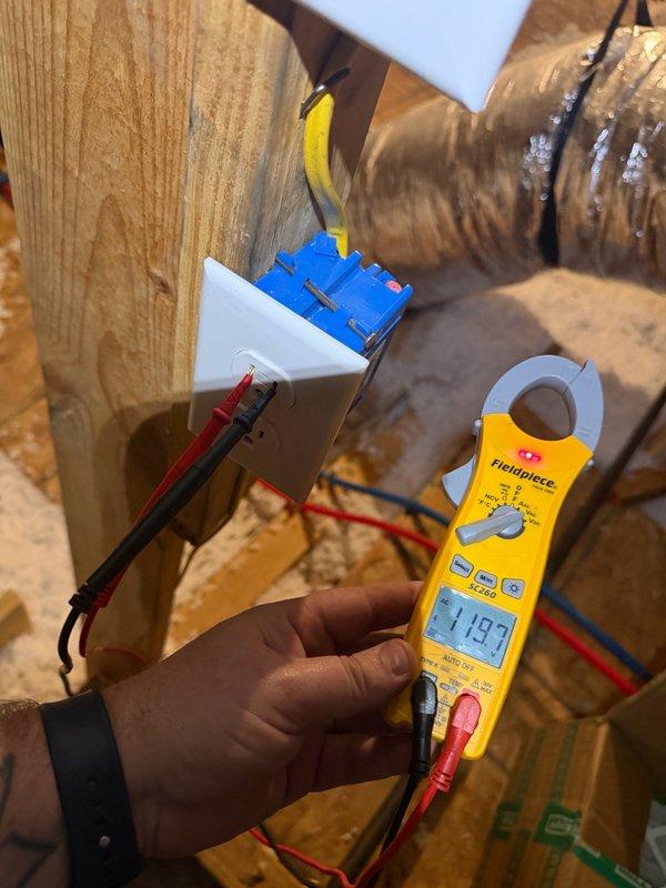 Completed installation of customer-supplied Honeywell dehumidifier system. Performed hardwire electrical connection at thermostat control, terminating multiple conductors to designated terminal block per manufacturer specifications. Verified proper voltage reading of 119.3V at equipment location using clamp meter. Installed and secured all wiring connections in attic space, ensuring proper routing through existing ductwork infrastructure. System tested and operational upon completion.