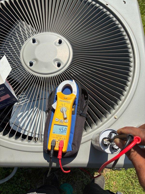 Responded to no-cooling complaint on residential air conditioning system. Upon arrival, performed electrical diagnostics on outdoor condenser unit using clamp meter to measure voltage and amperage at capacitor terminals. Testing revealed capacitor failure with readings of 360V and 45.0µF, outside acceptable operating parameters. Replaced defective run capacitor, verified proper electrical connections, and confirmed system returned to normal cooling operation with appropriate voltage and amperage readings.