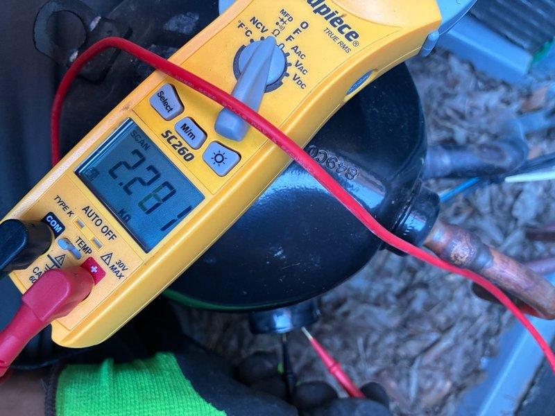 Completed warranty compressor replacement on basic Carrier system with soft start installation. Verified proper electrical connections at breaker panel with current draw reading of 24.1 amps, then confirmed compressor operation with final amperage of 73.3 amps at the unit, indicating successful installation and normal operating parameters.